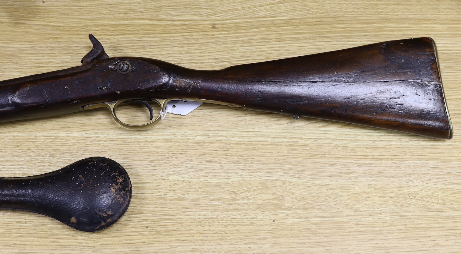 A 19th century percussion cap carbine musket with name stamped to lock plate and a shot flask, musket 94cms long